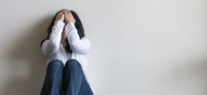 women with their head in their hands