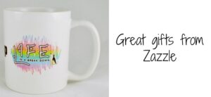 A white mug with colorful, artistic text partially visible. Beside the mug is the phrase Great gifts from Zazzle in a casual font.