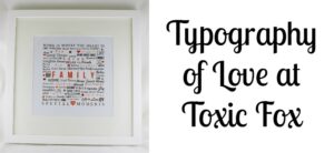 A framed artwork with the word Family and related phrases like Love and Good Times in various fonts and sizes, accented with red symbols. The text Typography of Love at Toxic Fox is on the right side.