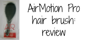 Image of an AirMotion Pro hairbrush in its packaging on the left, with AirMotion Pro hair brush: review written in black text on the right. The brush and text are on a plain white background.