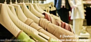 Close-up of a clothes rack with various garments on hangers. The image is overlaid with text: 5 Fashion Tips For a new look on a budget!.
