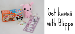 A pink plush keychain, a box with bear-shaped bread on it, a round container with small items, and purple nail stickers are arranged. Text reads, Get kawaii with Blippo.