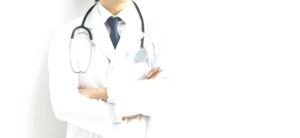 doctor standing against a white backdrop