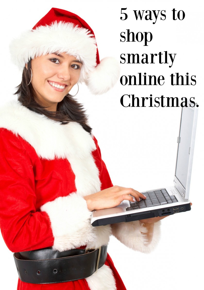 christmas female santa on a laptop computer isolated over a white background