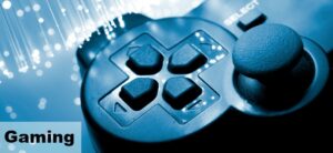 Close-up of a black video game controller with directional buttons and joystick. Fiber optic cables glimmer in the background. The word Gaming is displayed in the bottom left corner.