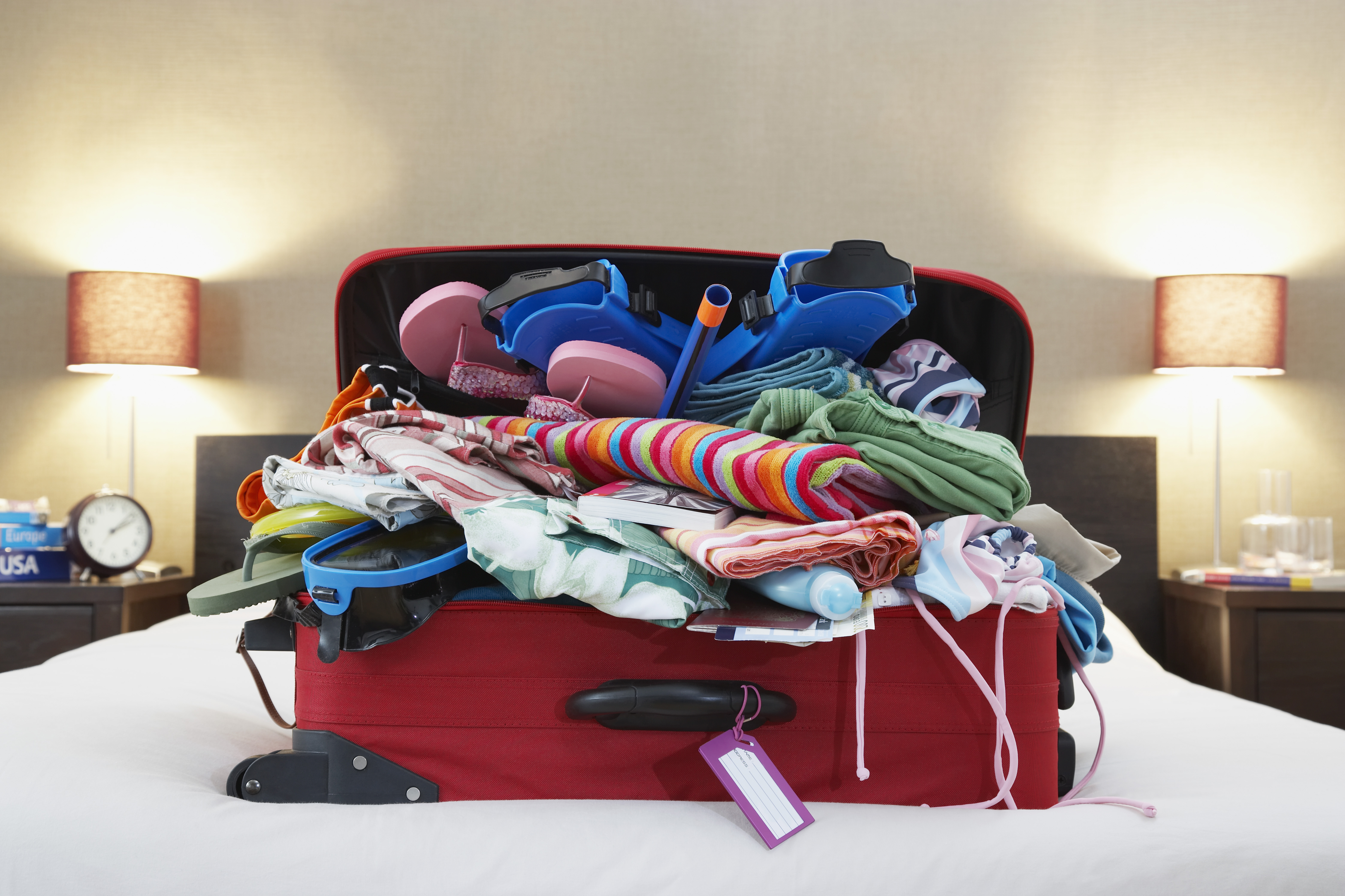 Pile of Clothing in a suitcase on the bed