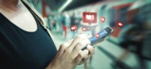 person getting likes on a smart phone