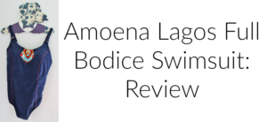 A purple full bodice swimsuit with an intricate decorative piece on the chest is displayed on a hanger shaped like a spotted animal. Text next to the swimsuit reads, Amoena Lagos Full Bodice Swimsuit: Review.