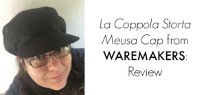 Sporting a black cap, glasses, and a smile, this individual stands beside the bold text: La Coppola Storta Meusa Cap from WAREMAKERS: Review.
