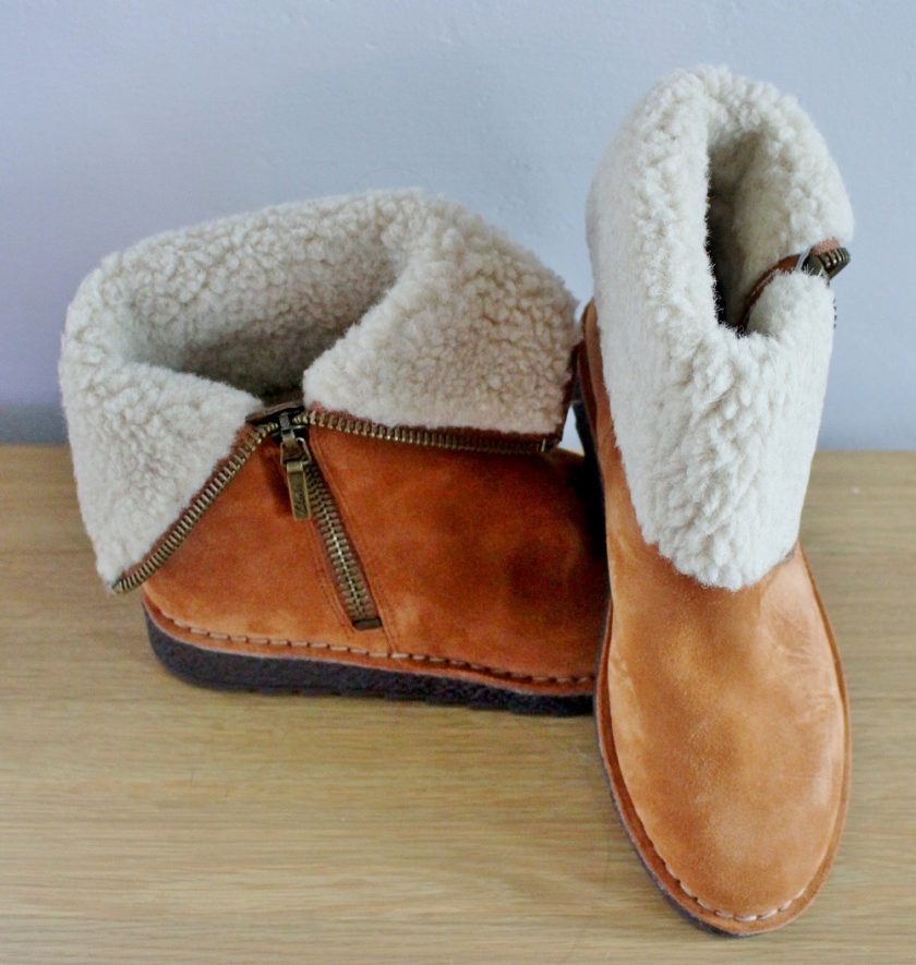 CLARKS Olso Beth from Brantano - soft tan suede outer, with a wool lining. Picture shows one boot to the side, showing the zip and one boot from the front. Both boots have the tops turned down to show off the inner wool lining, they can be worn this way as ankle boots or as calf boots.