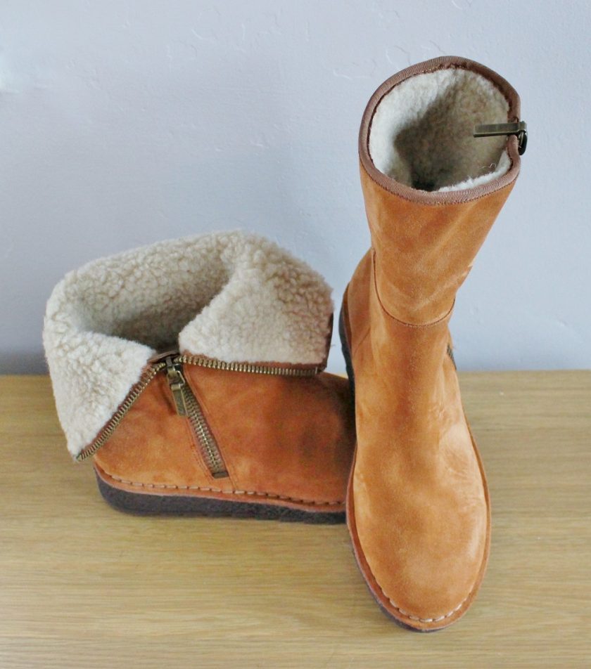 CLARKS Olso Beth from Brantano - soft tan suede outer, with a wool lining. Picture shows one boot on top of the other with one boot to the front and one to the side. The top boot is zipped up to the top, while the lower one is turned down showcasing the two different ways you can wear this boot.