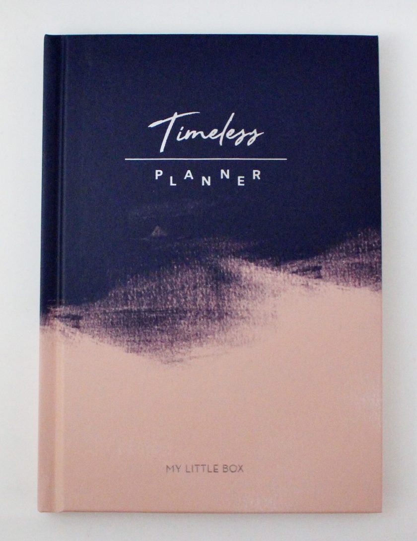 My Little Box January 2017 Timeless Planner, photo of the front cover top is blue with the wording Timeless Planner in white, this goes off into a pink bottom.