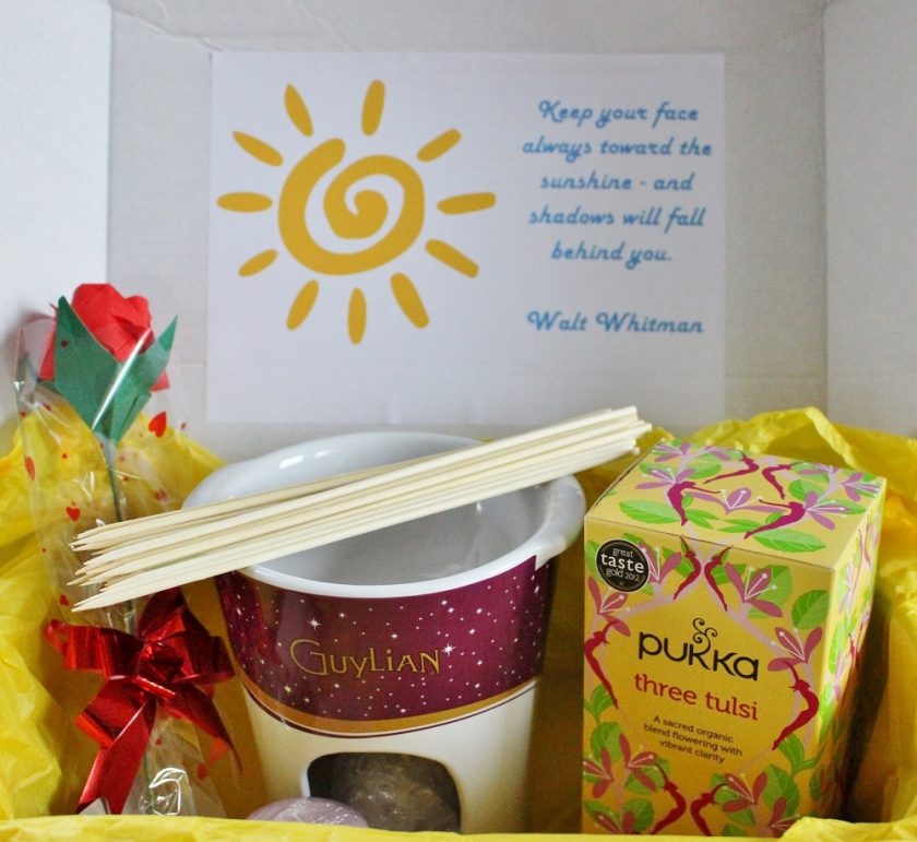 Pebblewise Sunshine Box inside of box with quote, paper rose, fondue set and tea