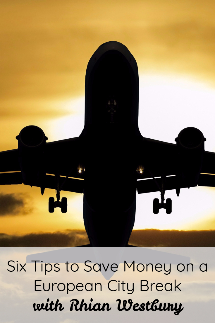 Silhouette of an airplane flying against a sunset sky. Below, text reads: Six Tips to Save Money on a European City Break with Rhian Westbury.
