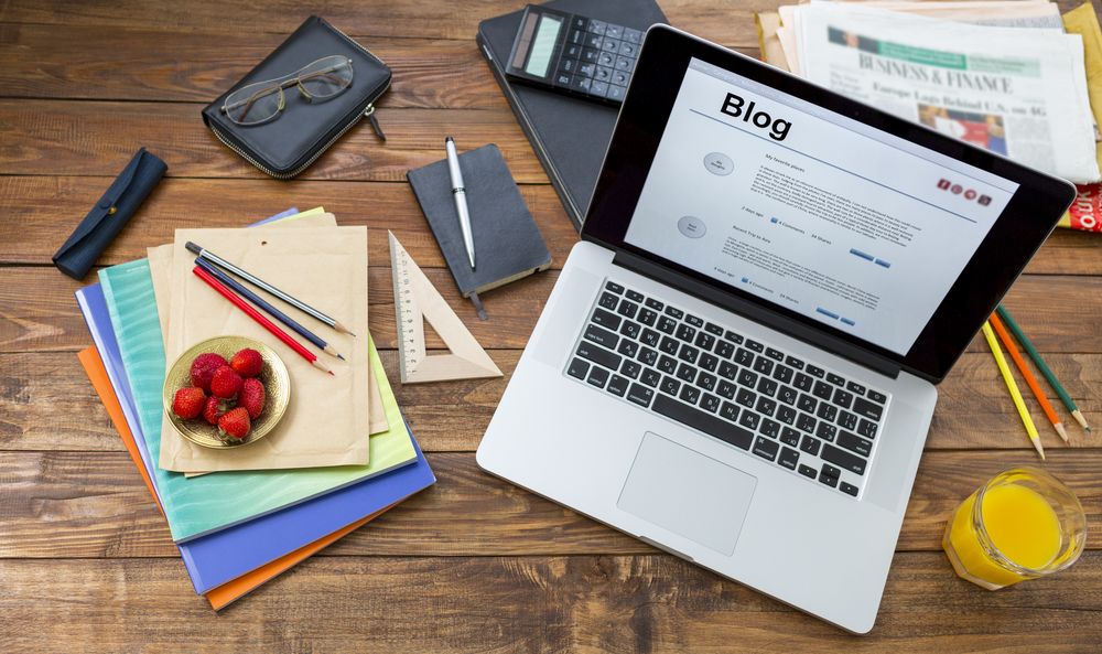 Laptop, papers and all things you might need to blog