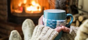 person sat in front of a warm fire