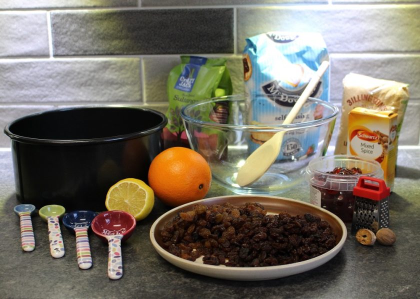 Christmas at Debenhams - Christmas cake making, cake tin, measuring spoons, lemon, orange, mixing bowl and dried fruit