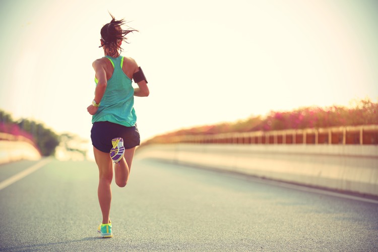 lady running along the road