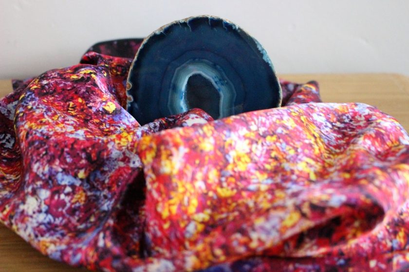 Aithne Vibrations of Carmine Scarf surrounding a Blue Agate Geode Crystal