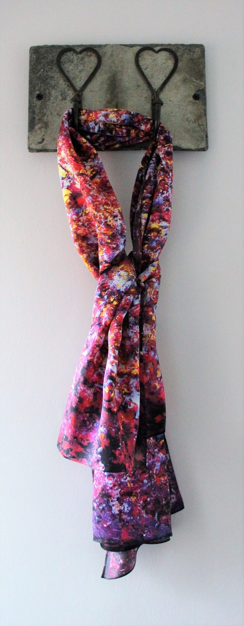 Aithne Vibrations of Carmine Scarf Hanging up.