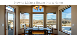 Dining room with large windows showing a snowy landscape. A wooden table and chairs are centered under a chandelier. The view includes hills and houses, with text at the top reading How to Make a House Into a Home.