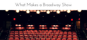 An empty theater with a view of red seats and bright stage lights. The header reads What Makes a Broadway Show above the seating area.
