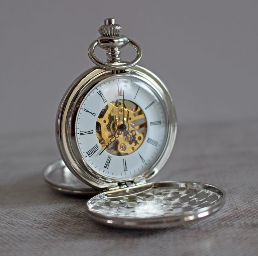 Heritage Dual-Side Pocket Watch from Personally Presented - Watch viewed with both sides open and stood up. You can see the face and inner workings.