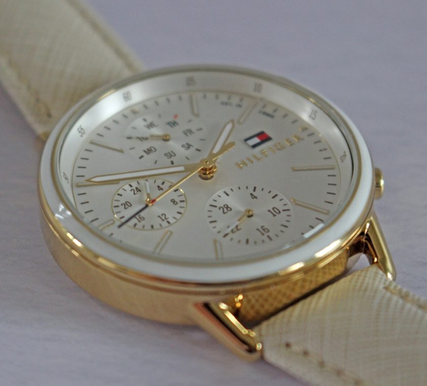 Tommy Hilfiger Womens Carly White Leather Strap White Dial Picture of the Whole Watch on White Background close up of watch face from the side.