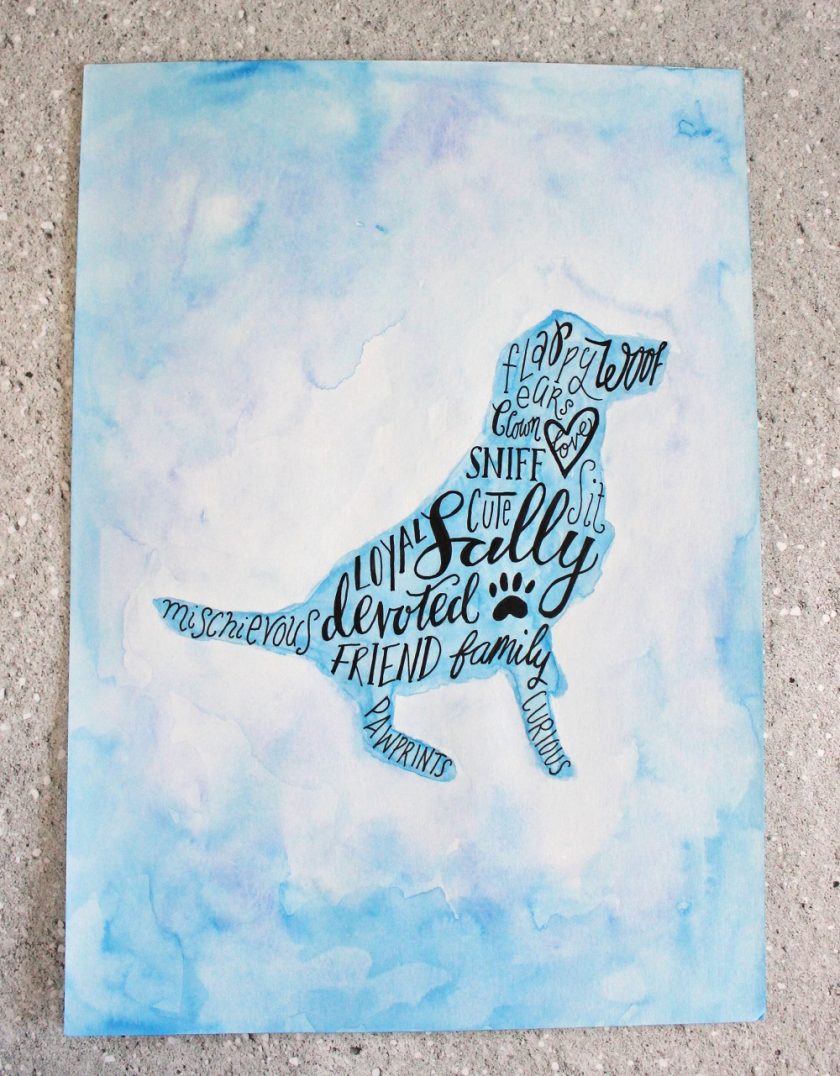 Calligraphy inside a silhouette of Sally Dog using words about her. Image water coloured in blue