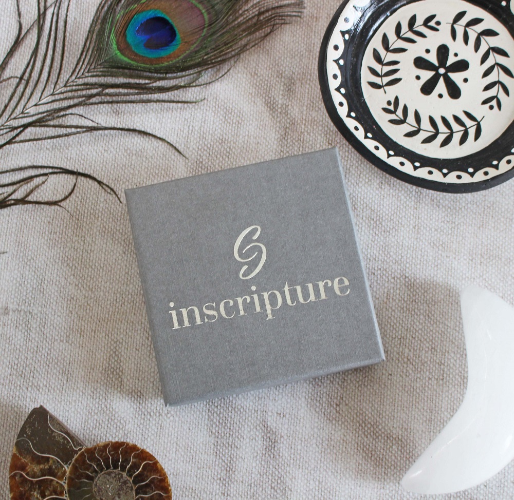 Photograph of the box - grey in colour with the Inscripture Logo o the front.