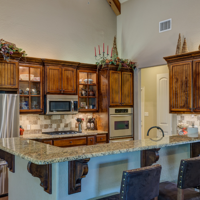 View of a kitchen with wooden cupboard doors