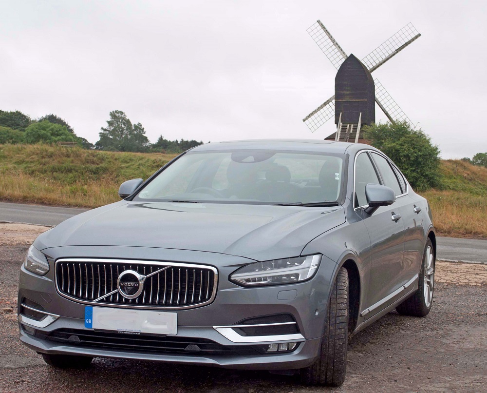 Volvo S90 pictured in front of a windmill