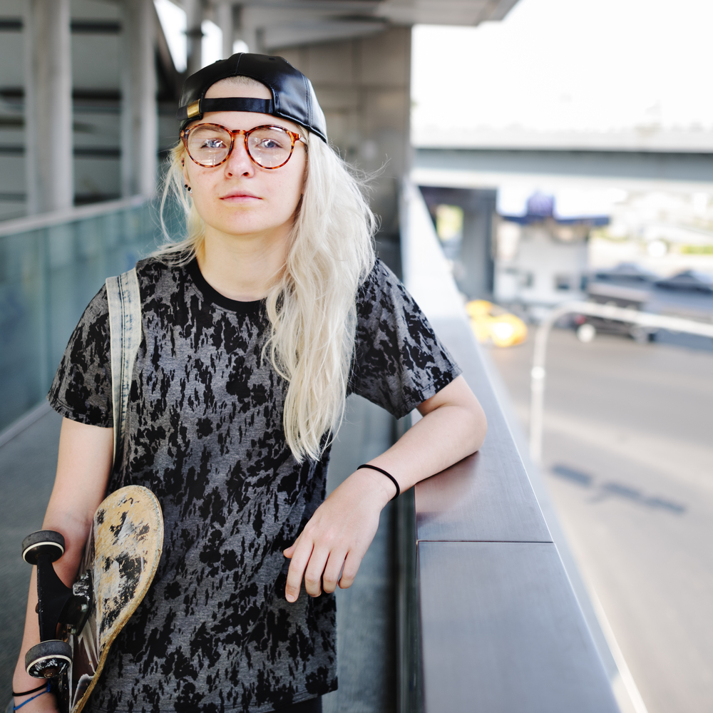 Young Woman Holding Skateboard Outdoors Concept