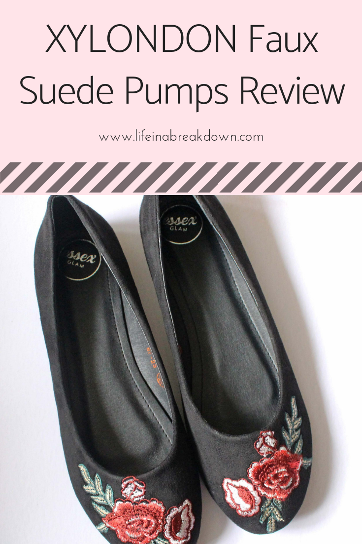 Black faux suede pumps with floral embroidery in red and green on the toes. Text on the image: XYLONDON Faux Suede Pumps Review and www.lifeinabreakdown.com. Background is light pink with a striped design.