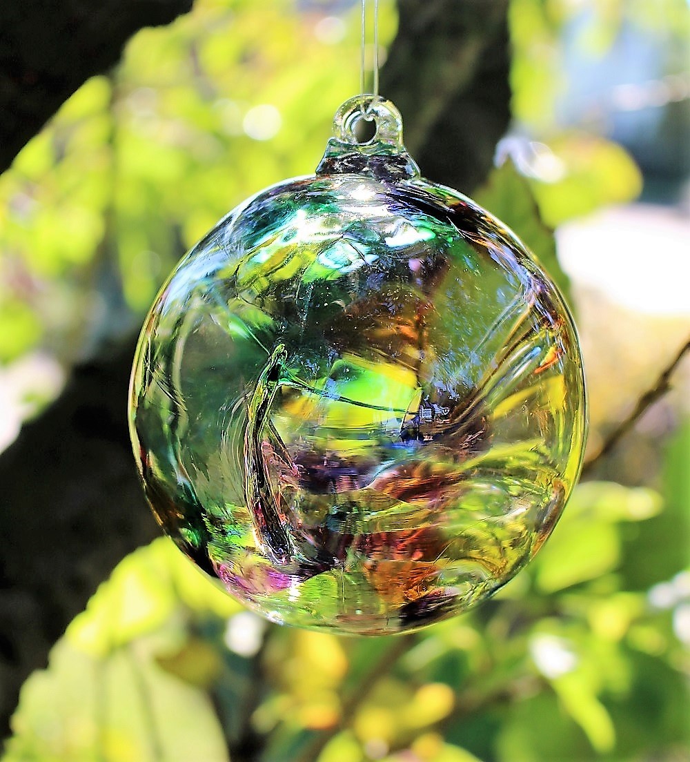 Rainbow Glass Witch Ball from Peach Perfect Hanging in a Tree