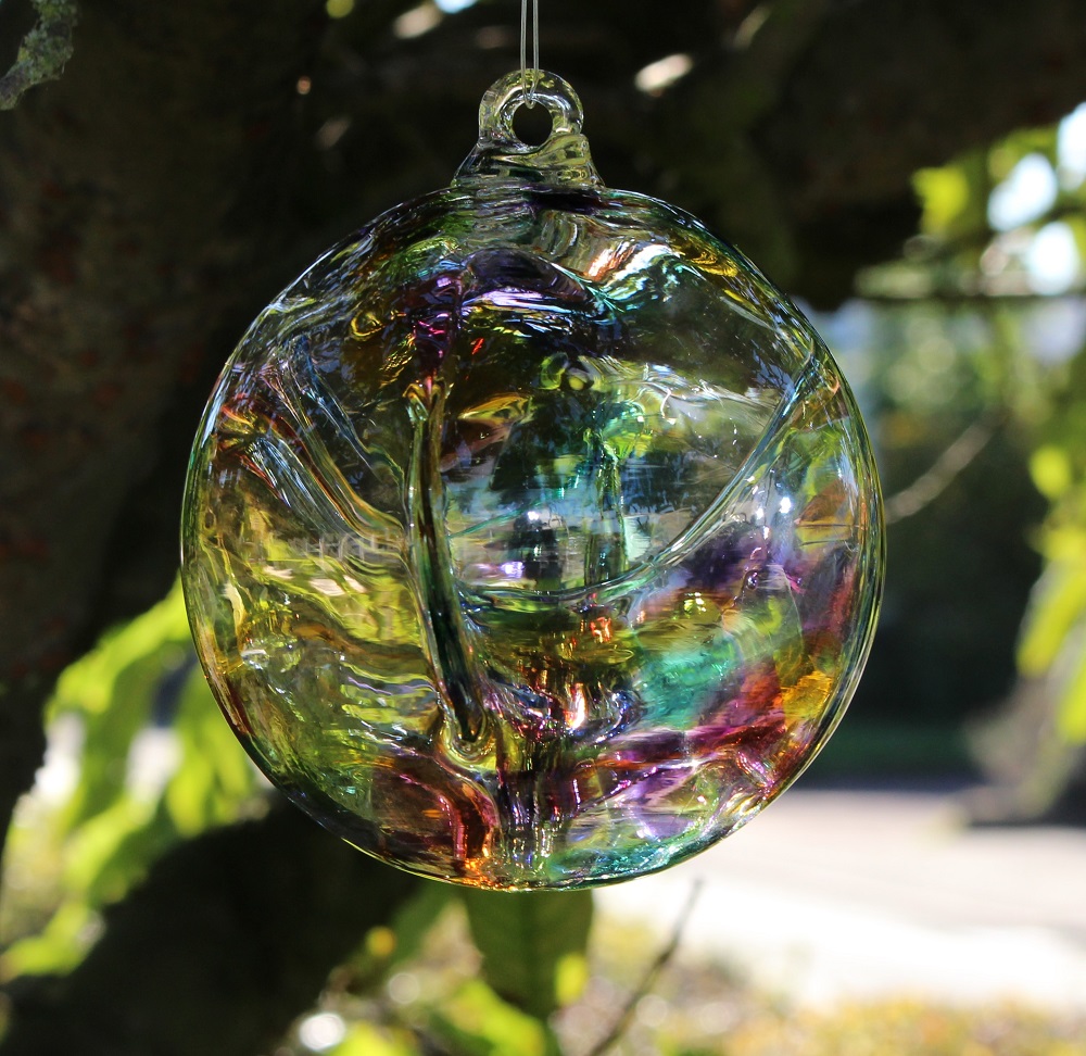 Rainbow Glass Witch Ball from Peach Perfect Hanging in a Tree