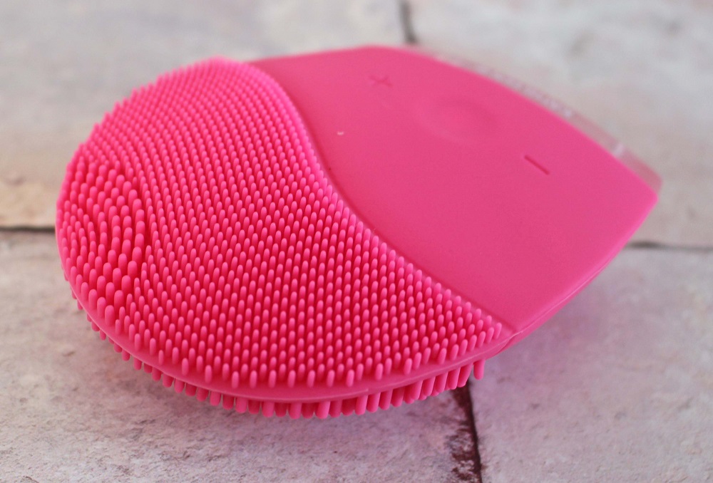 Kathleen Facial Sonic Cleansing Device - it is a pink device with stippling one end and a part to hold it the other