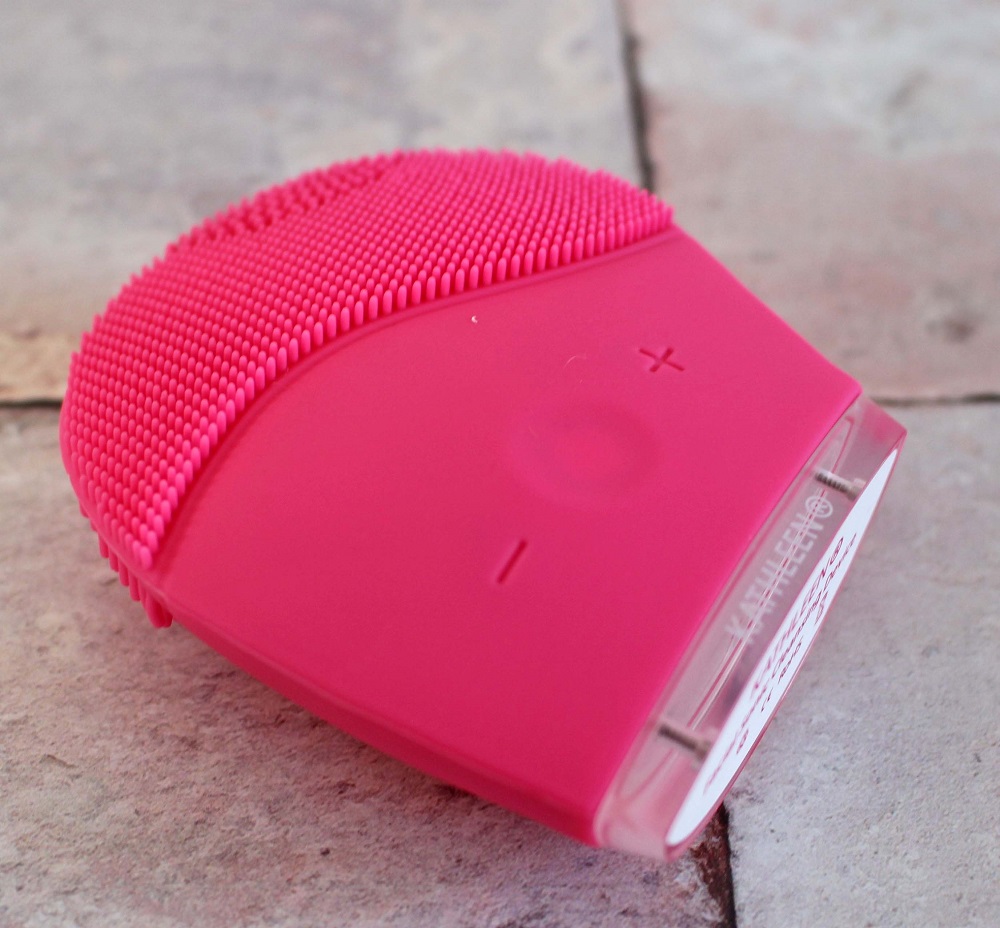 Kathleen Facial Sonic Cleansing Device - it is a pink device with stippling one end and a part to hold it the other