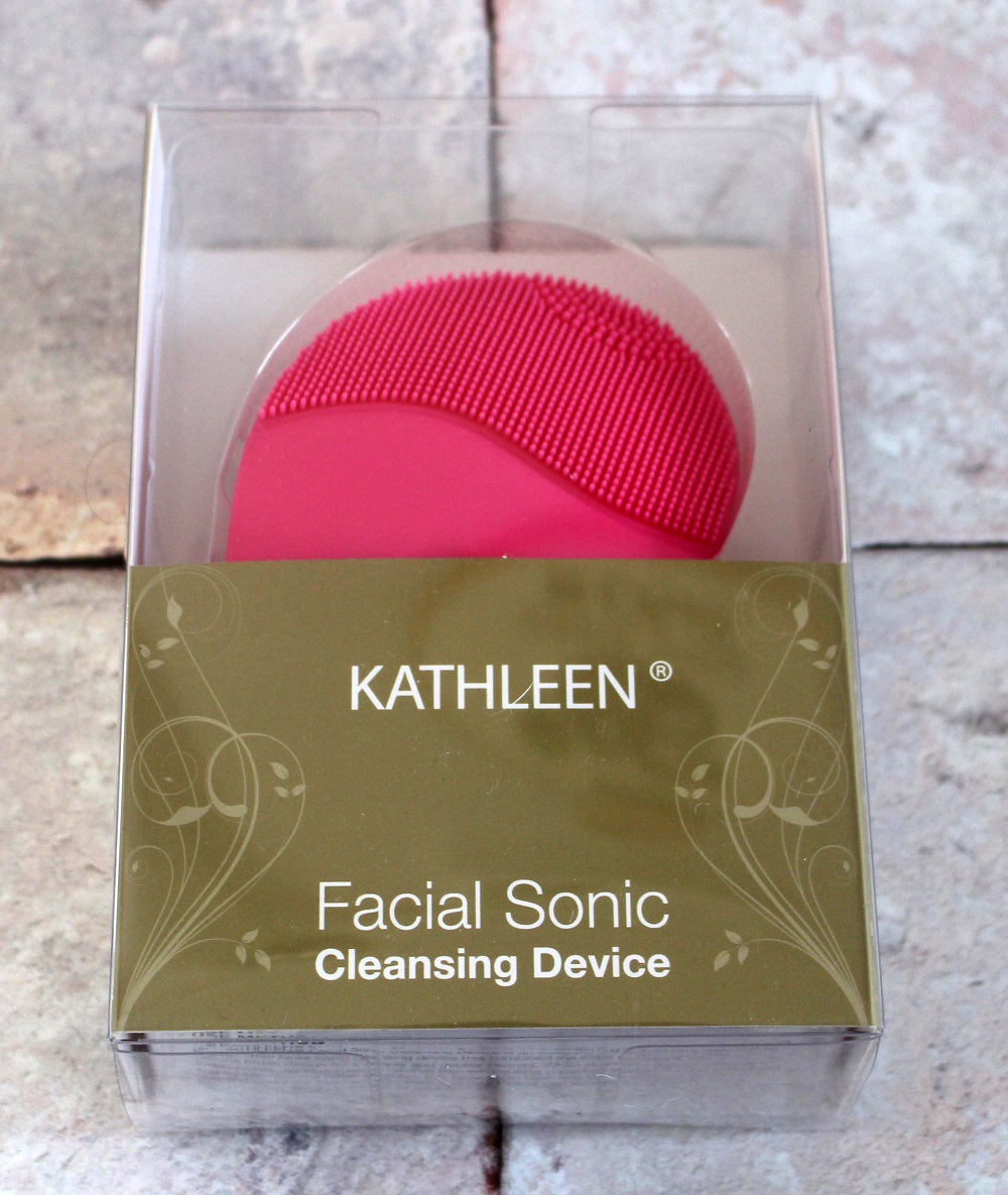 Kathleen Facial Sonic Cleansing Device - it is a pink device with stippling one end and a part to hold it the other