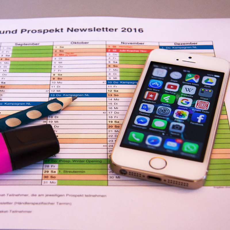 Phone with schedule in the background