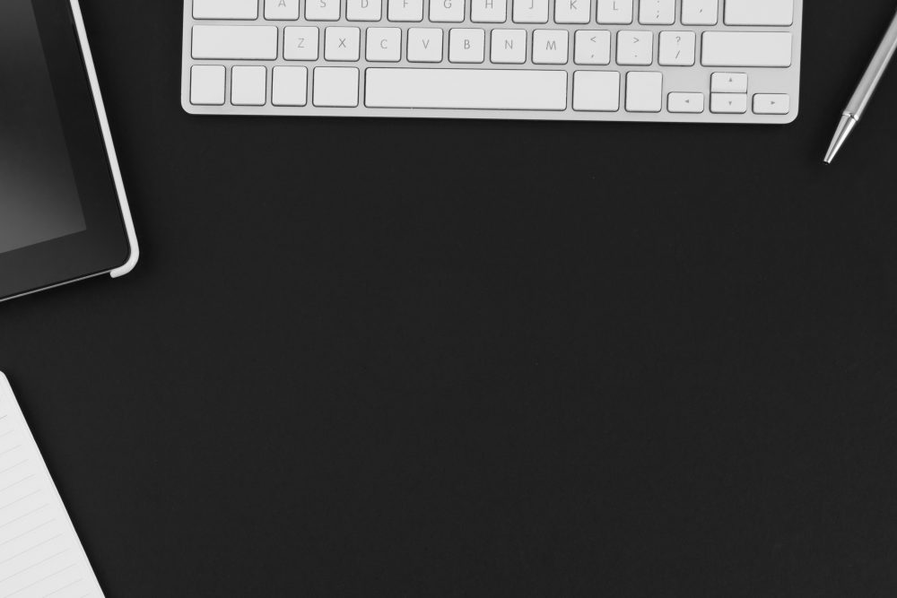 white keyboard on a black background