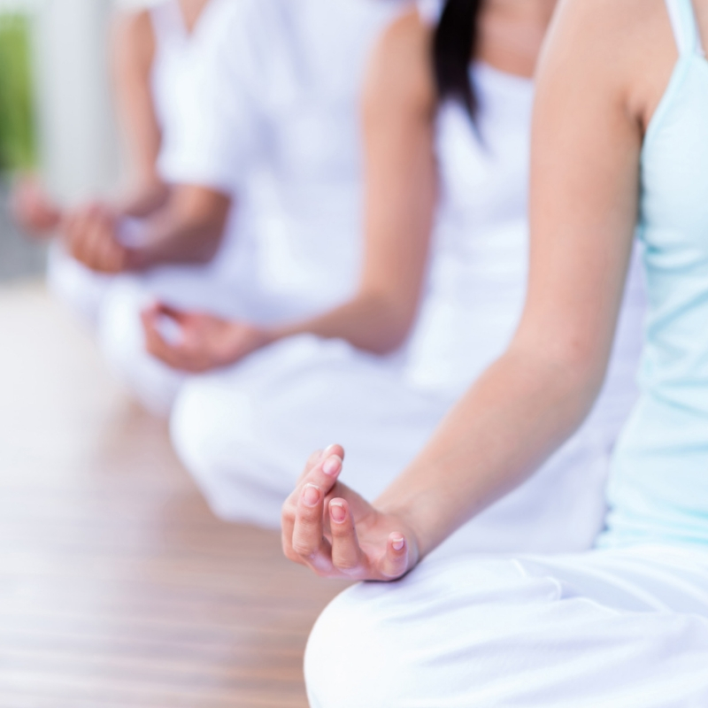 People sat in a yoga class
