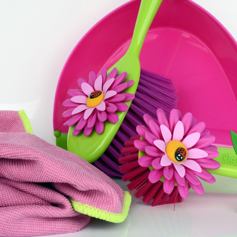 pink and green cleaning utensils