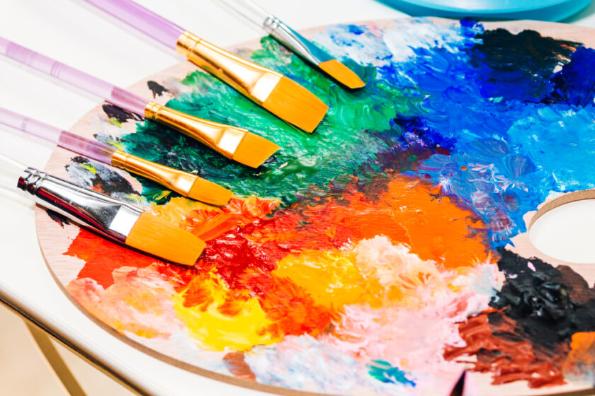 Set for drawing and art painting with color palette and watercolor paints on table