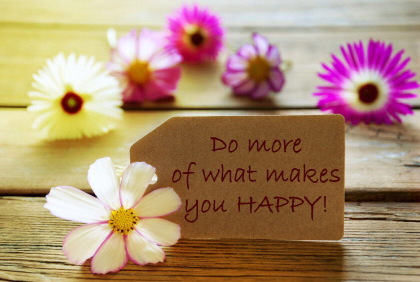 Brown Label With Sunny Yellow Effect With Life Quote Do More Of What Makes You Happy With Purple And White Cosmea Blossoms On Wooden Background Vintage Retro Or Rustic Style