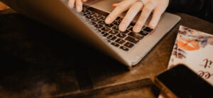 picture of someones hand on a keyboard