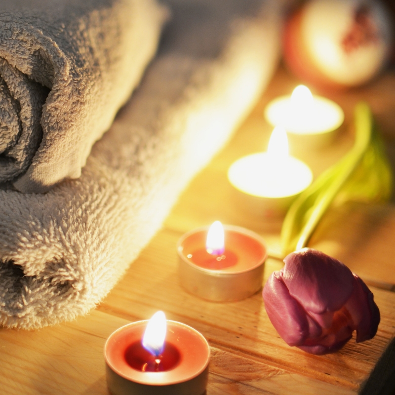 towels candles and a rose