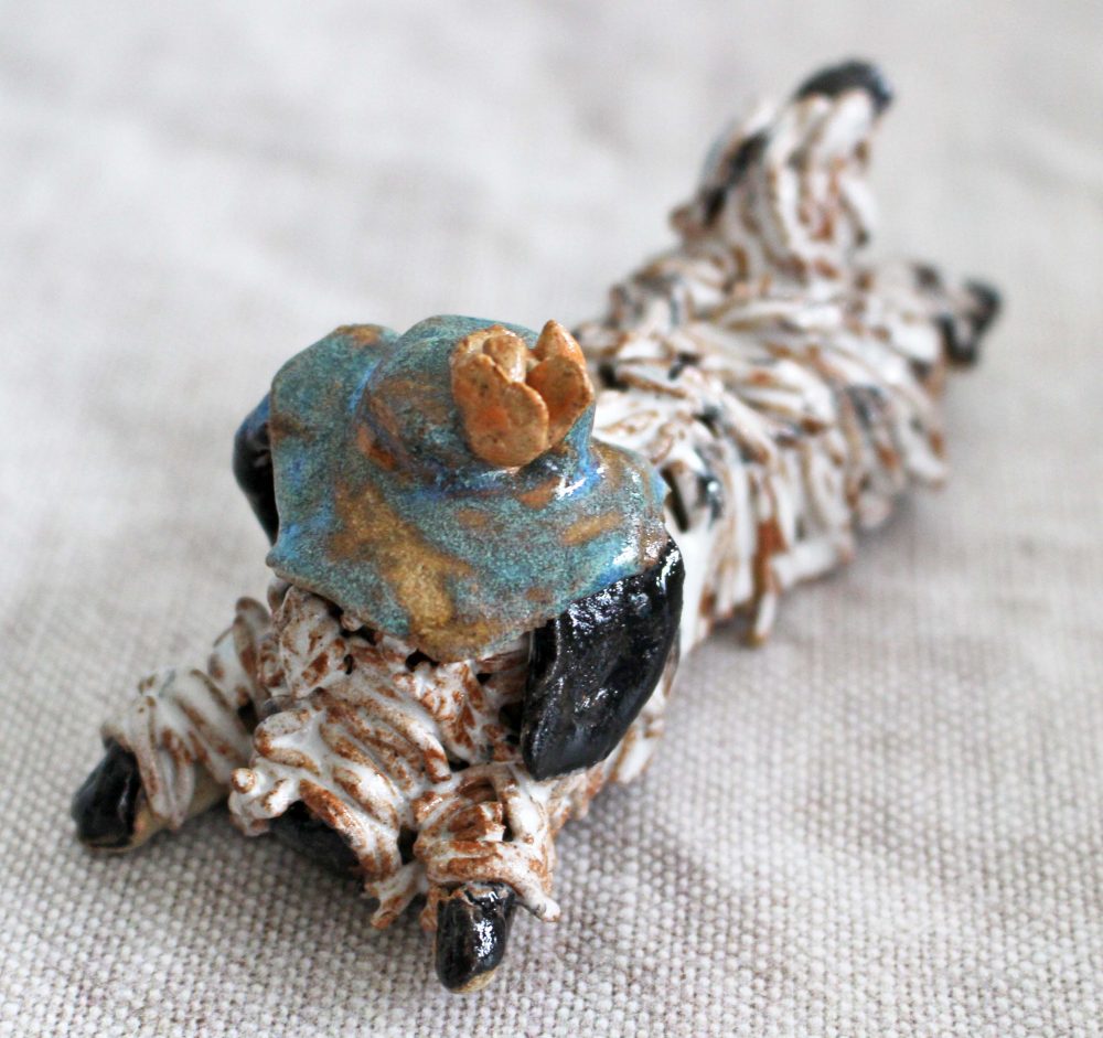 D H Potteries Dog with Cap on
