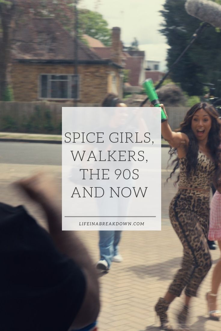 A woman in a leopard print outfit energetically holds a green can. A boom microphone is visible above. Text reads, Spice Girls, Walkers, The 90s and Now. Background shows a suburban street and houses.