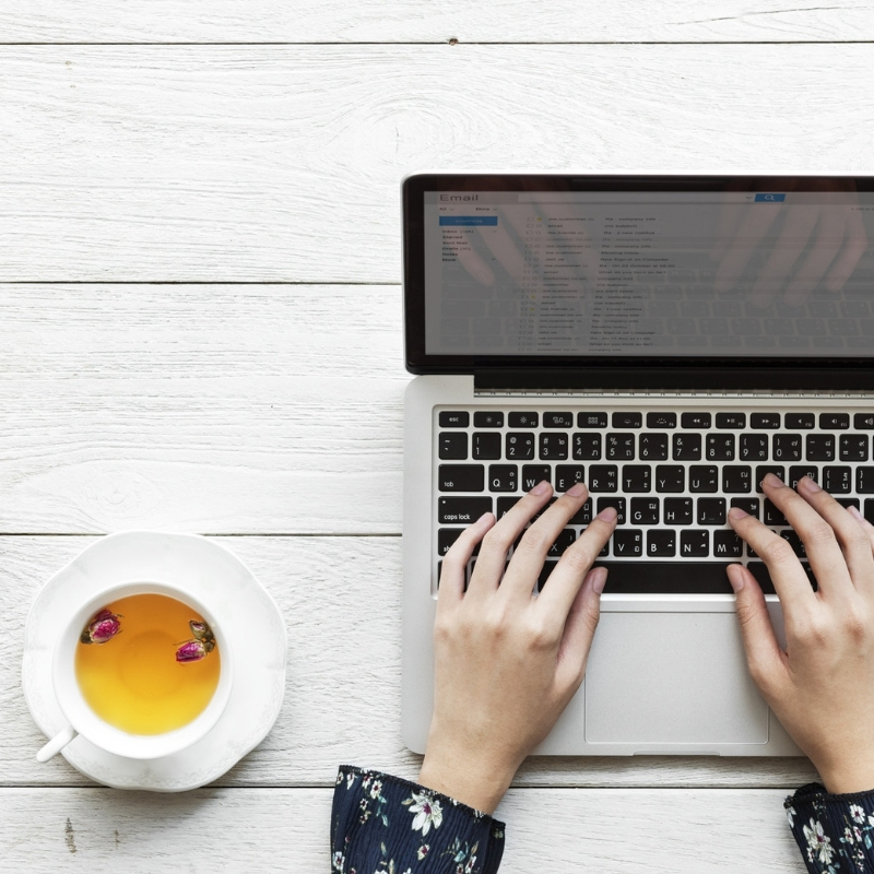 laptop and a cup of chamomile tea